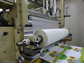 検知器付きPP貼り機